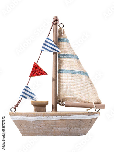 Closeup of sailboat model with blue and white sail in retro style isolated on white background