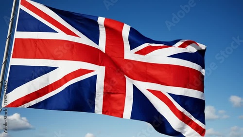 Union Jack flag waving proudly against a clear blue sky