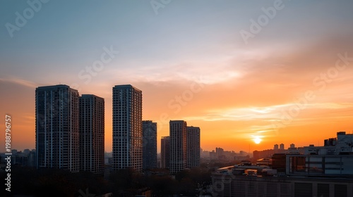 Modern high rise buildings framed beneath a dramatic colorful sunset sky