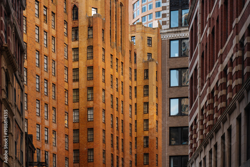  Tall brick buildings in narrow city street canyon
