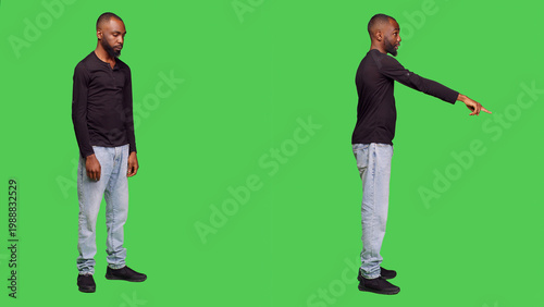 Quadro em tela Confident adult pointing at the floor waving at someone, calling over to say they dropped something on camera