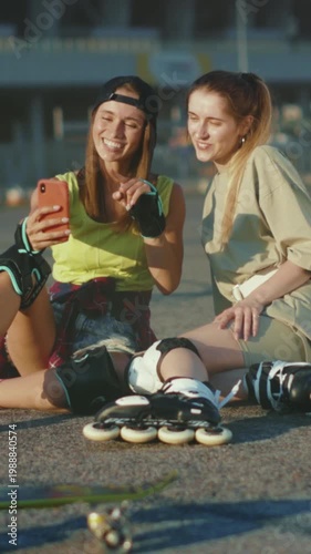 Laughing friends capture skating moments, Casual urban afternoon with friends filming skateboarding fun scene