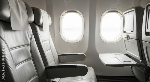 Empty Airplane Seats and Windows with Tray Table - Travel and Aviation Concept