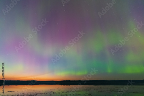 Fotografie Evening Glow Meets Northern Lights at Little Kenosee Lake, Saskatchewan