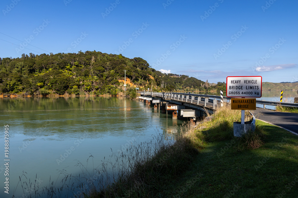 Fototapeta premium The Waiharakeke Bridge in Kawhia Harbour, Owhiro, Waikato, New Zealand. has a gross weight limit of 44000 kg for heavy vehicles, indicating a need for careful transport planning.