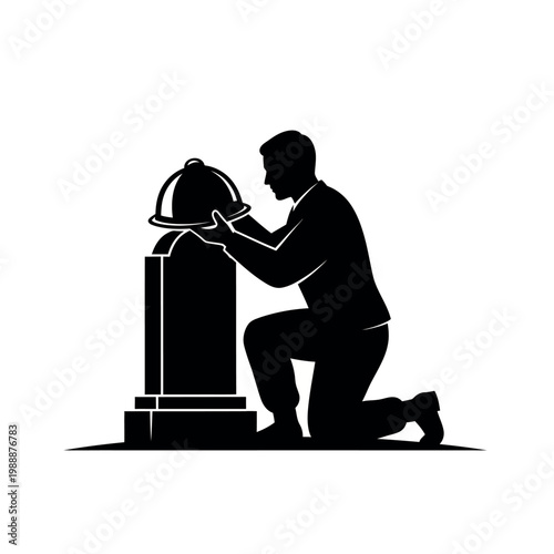 Silhouette of a person placing a hard hat on a tombstone.