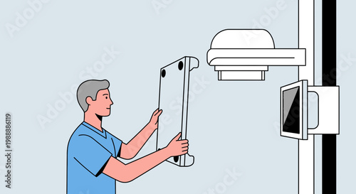 Radiology technician installs X-ray detector panel in examination room