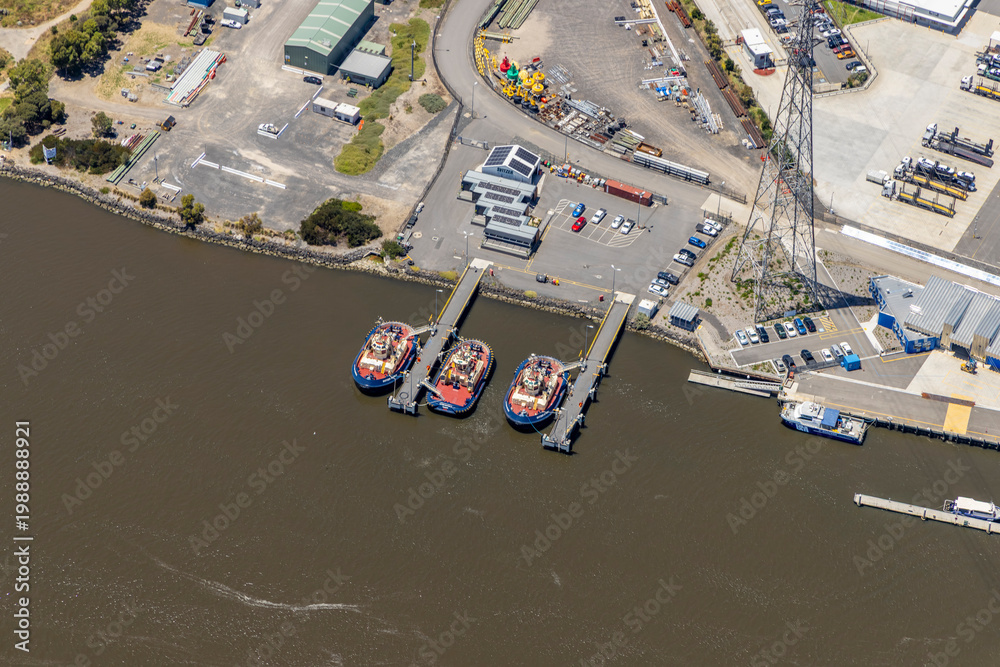 Fototapeta premium port melbourne aerial view tugboats dock waterfront industrial area parking lot marina boats cargo shipyard harbor victoria australia