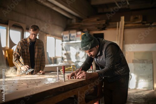 Men working with wood in joinery