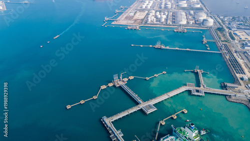 Photos Massive LNG storage tank facility at an industrial coastal terminal
