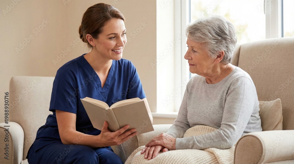 Fototapeta premium Nurse reading a book to elderly woman while sitting indoors 