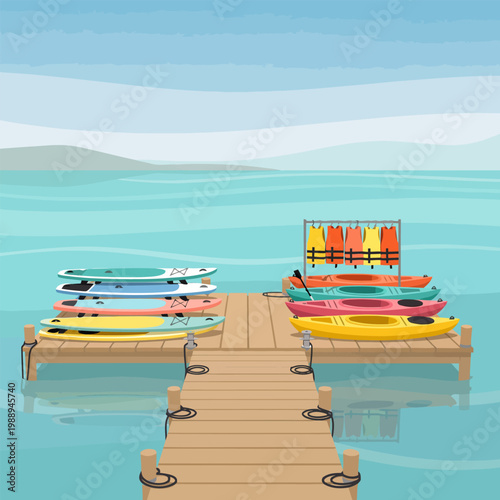 Kayaks and paddleboards on a wooden dock by the water