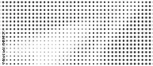 Halftone dots pattern with gradient effect on white background for design
