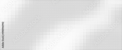 Halftone dots pattern with gradient effect on white background
