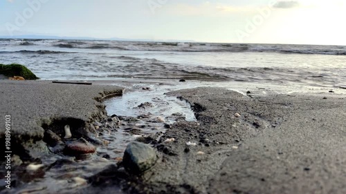 a small stream flowing toward the beach