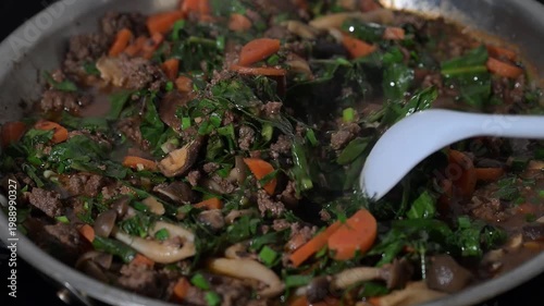 Cooking of Simple Dinner with Ground Bison, Mushrooms, Carrots and Italian Dandelion Greens
