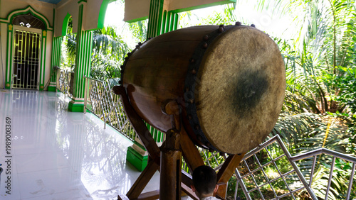 A bedug (beduk) is a musical instrument used for religious communication. In Indonesia, the bedug is typically used to signal the arrival of prayer times. It is typically made from cow or buffalo hide