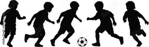 Boys playing soccer silhouette.