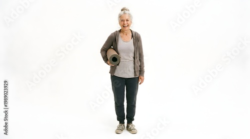 Active Senior Woman with Yoga Mat Smiling on White Background