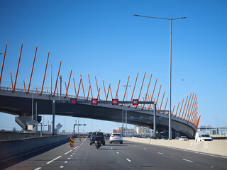 BusyMelbourne Freeway Under a Unique Bridge 
