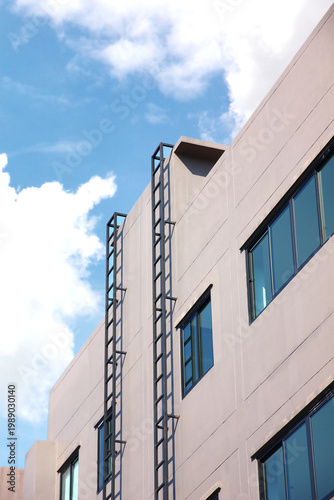 emergency steel stairs install out side building fire exit express way to ground . iron structure install on the wall resident fire exit stairs