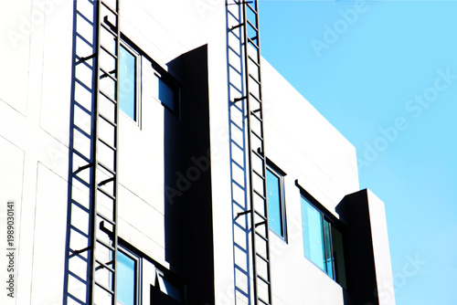 emergecy steel stairs install out side building fire exit express way to ground . iron structure install on the wall resident fire exit stairs