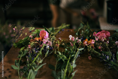 bouquets being assembled on work bench