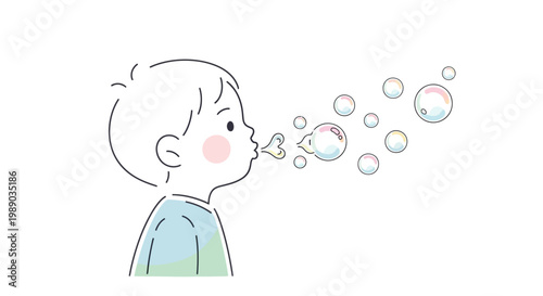 Little boy blowing soap bubbles outside.