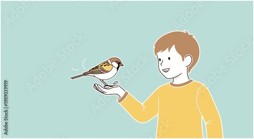 Boy holding a small brown bird.