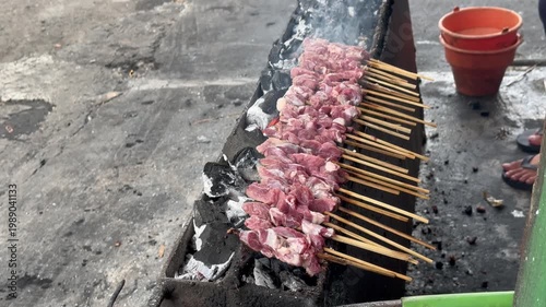 Tengkleng cooking, Sate Buntel Close-up of cooking process using traditional stove. Spicy Tengkleng or Tongseng - Indonesian food, Sate Buntel Solo