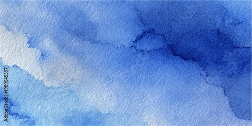 Grunge watercolor texture of blue paint creates a cold winter sky pattern with frozen ice and frost on a snowy paper surface for a seasonal Christmas wallpaper background