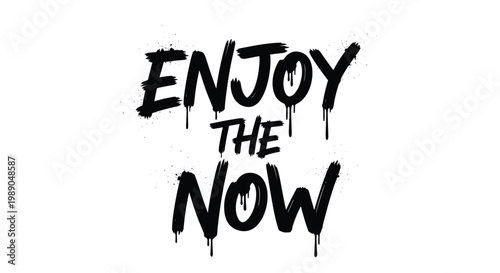 Gritty urban style graffiti text says enjoy the now in black spray paint font with realistic drips on a plain white background.