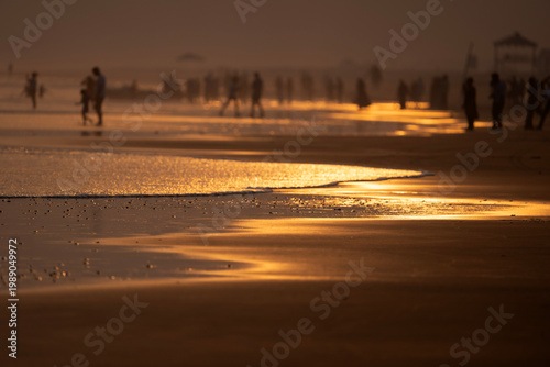 Sunset Reflections on Tranquil Ocean Waves with Golden Sands 