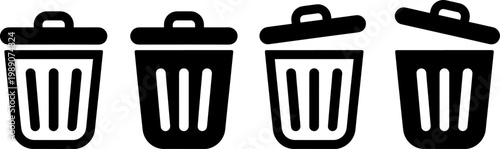 Four black trash bins lined up in a row with lids closed