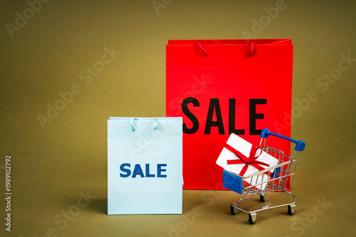 sale sign on cardboard boxes