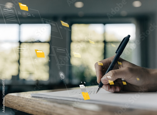 Hand writing on a book with floating digital folder interface, Transforming handwritten notes into organized digital data for enhanced information management