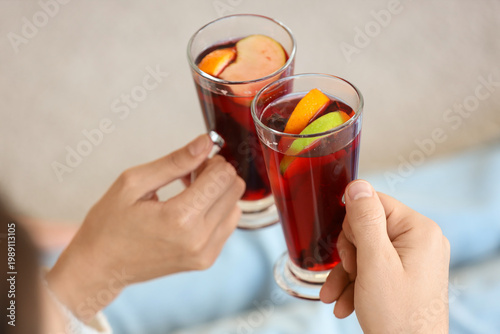 Young couple with glass cup...