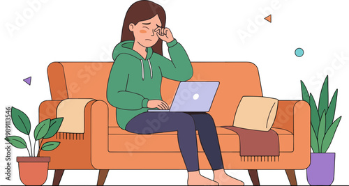 Woman sits on couch with laptop and talks on phone at home