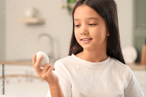 Cute Asian girl with boiled...
