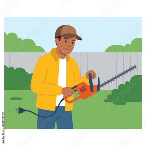 Man using electric hedge trimmer in backyard garden outdoors
