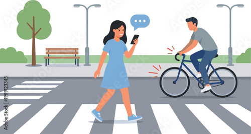 A woman walks across a crosswalk while using her phone as a man rides a bicycle nearby.