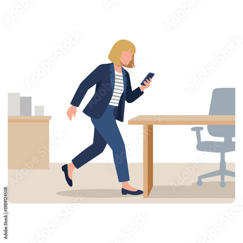 Woman walks quickly past office desk with chair holding smartphone