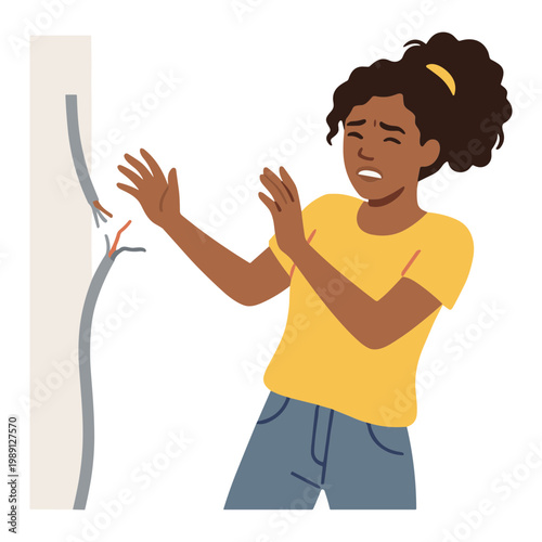 A worried young woman reacts to a large crack in a wall.