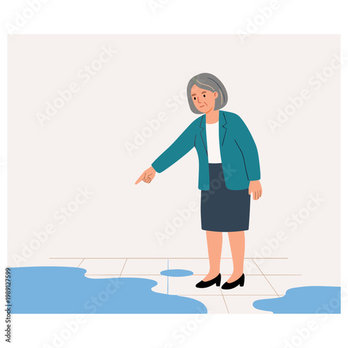 Woman points at a blue liquid puddle on the tiled floor indoors.
