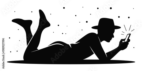 Silhouette of a person in a hat lying down and using a smartphone