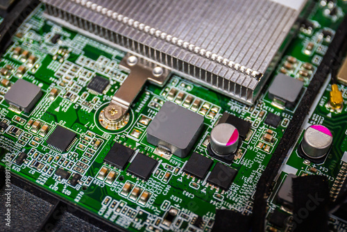 Close Up of Chips on boards of computer and smart devices or laptop notebook Processing phone with heat sink. Select focus and Copy space background