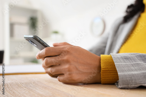 Young businesswoman using m...