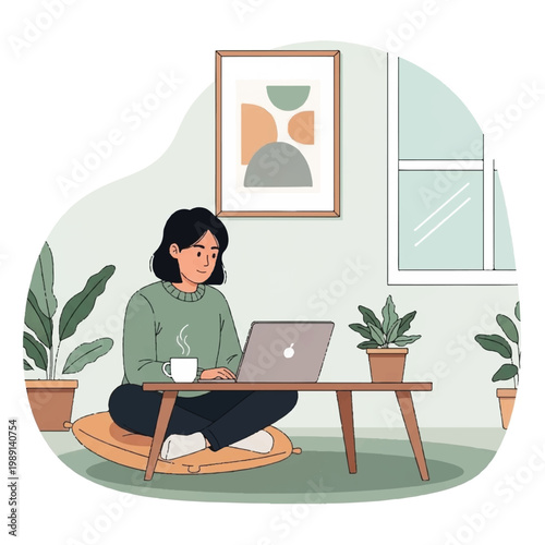 Young woman working on laptop at home with coffee.