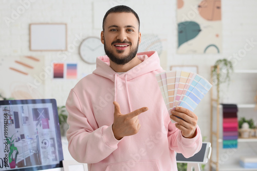 Male interior designer poin...