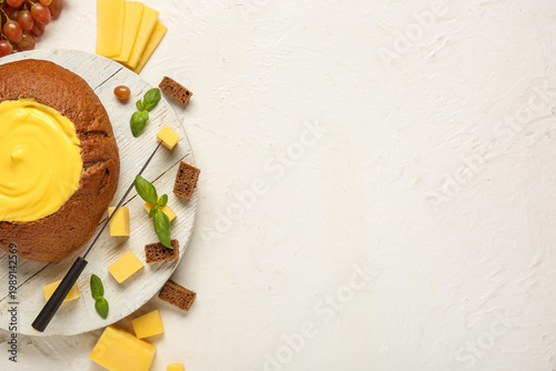 Cheese fondue in bread with...